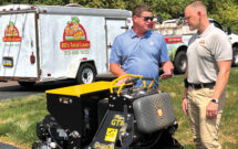 Stinger’s Dustin McGehee (left) talks about the GT30 with Ryan Dittes of RD’s Total Lawn. (Photo: LM staff)