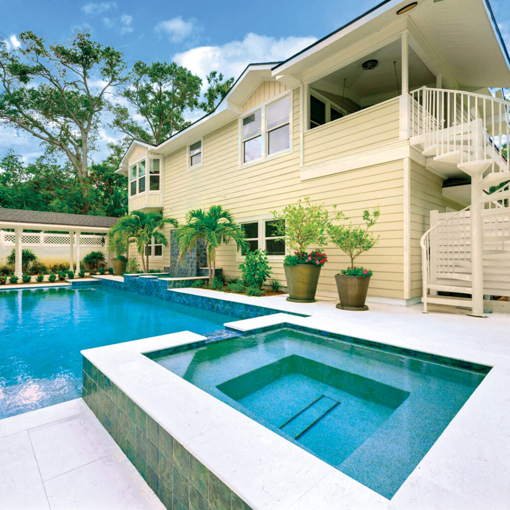 Lee says the team did the tiling, travertine decking, lighting and all the other basics to fully modernize the pool and new hot tub. (Photo: Landscapes by Randy Lee)