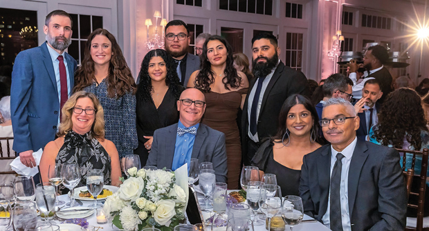 Bruce Allentuck (seated center) with others from Allentuck Landscape at the CaringMatters award dinner. (Photo: Bruce Allentuck)