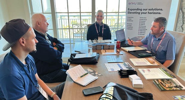 Envu’s Bill Roddy (center) and Ryan Madden (right) met with two LM Growth Summit attendees. (Photo: LM staff)