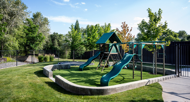After the team worked with the client on a few options, they settled on synthetic turf under the playground to keep it clean and aesthetically pleasing. (Photo: Dave Koch at R\E Media Utah)