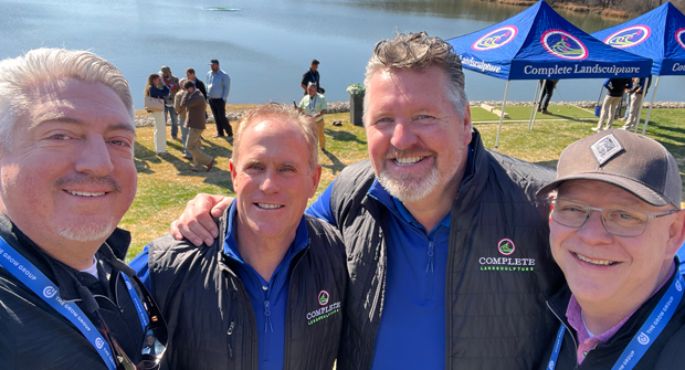 Complete crew: Jones and Hollister grabbed a selfie with the co-owners of Complete Landsculpture in Dallas — Chris Strempek (left) and Gene Freeman. Complete Landsculpture opened it’s doors to attendees at GROW! 2026 as the event’s host company. (Photo: LM staff)