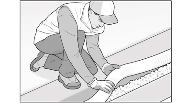 Prepare the base and place the pipe. Add a few inches of clean, washed gravel to create a stable base. Lay perforated pipe with holes facing downward to maximize infiltration, connect all fittings and check the slope again before covering. (Illustration: David Preiss)