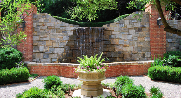 The Myatt team also maintains two water features, including this waterfall and another fountain. The pool at the top of the waterfall is an adored swimming pool by the homeowner’s family. (Photo: Myatt Landscaping and Construction)