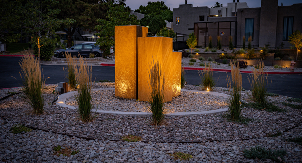 This water feature was designed with a 360-degree view. Emphasizing the view as you enter the community are the selection and placement of the plant material. (Photo: Brent Peterson with Antigravity Films, LLC)