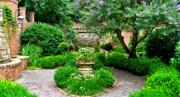 "It's the epitome of a Southern garden, in my opinion,” Champion says. “When you walk through that back gate, it's just lush. I mean, there's ferns and hostas and hydrangeas and about everything you can think of blooming.” (Photo: Myatt Landscaping and Construction)
