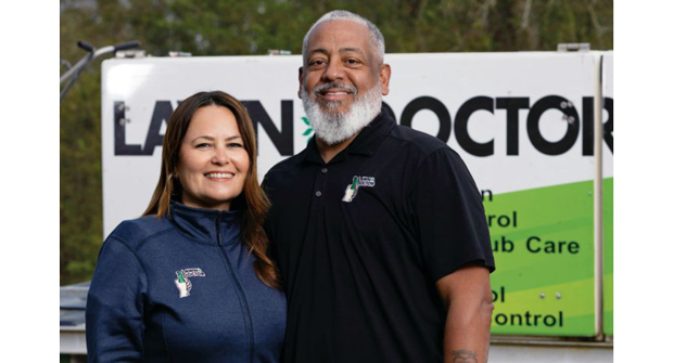 After a 24-year military career, Valle (shown here with his wife, Lara) invested in a Lawn Doctor franchise. (Photo: David Steele)