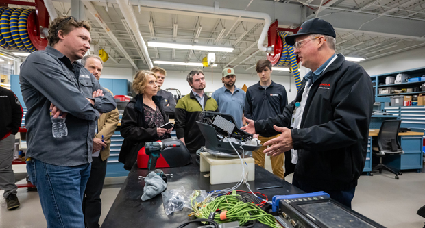 Brian Doklovic, project lead of ZTRs (far right), gave insights into the testing procedures inside the many rooms of Honda's R&D facility. (Photo: Honda)